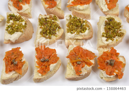 Vegan Salmon Carrots and Pistachio Topped Bruschettas with Cashew Cream 138864463