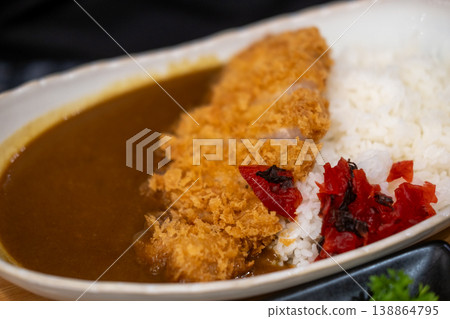 Tonkatsu Curry, a plate of rice with fried pork and curry sauce. Japanese food Tonkatsu Curry, a plate of rice with fried pork and curry sauce. Japanese food 138864795