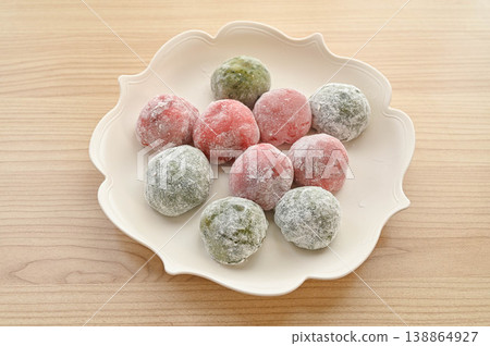 Springtime Japanese sweets: Assortment of mugwort mochi and strawberry mochi Springtime Japanese sweets: Assortment of mugwort mochi and strawberry mochi 138864927