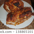Appetizing baked meat with spices and garlic on a white plate. Juicy pork with a ruddy crust, cooked at home 138865101