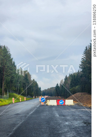 Road closed for construction with detour signs 138866250