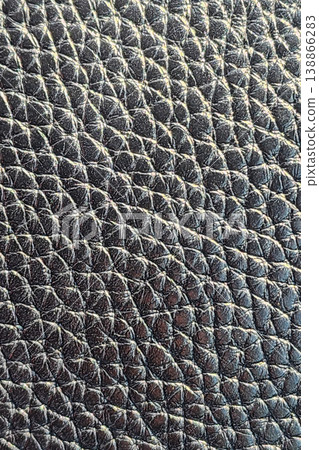 Black leather textured surface background showing pattern 138866283