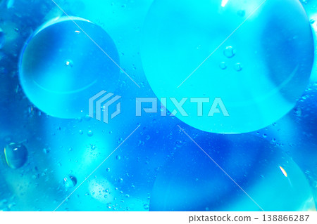 Oil bubbles close up. circles of water macro. abstract light blue background Oil bubbles close up. circles of water macro. abstract light blue background 138866287