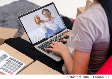 Relaxed and Joyful Asian young woman in a cozy living room, headphones on, listening to music and enjoying the moment. Her relaxed posture and infectious smile convey happiness and contentment Relaxed and Joyful Asian young woman in a cozy living room, headphones on, listening to music and enjoying the moment. Her relaxed posture and infectious smile convey happiness and contentment 138868084