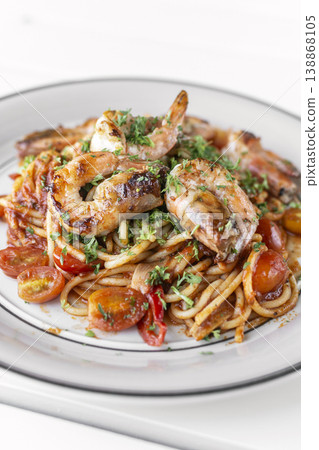 shrimp and tomato diavolo spicy spaghetti on white table at outdoor restaurant in italy shrimp and tomato diavolo spicy spaghetti on white table at outdoor restaurant in italy 138868105