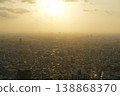 A view of the city at sunset from the Tokyo Metropolitan Government Building observation deck. 138868370