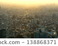 Miniature diorama-style photograph: A view of the city at sunset from the Tokyo Metropolitan Government Building observation deck. 138868371