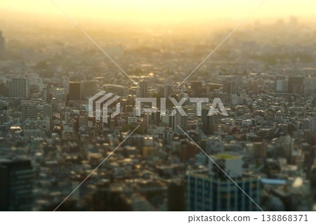 Miniature diorama-style photograph: A view of the city at sunset from the Tokyo Metropolitan Government Building observation deck. 138868371