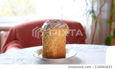 Ukrainian Easter bread paska white icing glaze festive dessert white plate tablecloth tradition Ukrainian Easter bread paska white icing glaze festive dessert white plate tablecloth tradition 138868643