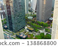 A miniature diorama-style photograph of the Mitsui Building and Shinjuku Center Building Square at sunset, as seen from the Tokyo Metropolitan Government Building observation deck. 138868800
