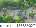 A miniature diorama-style photograph of Shinjuku Central Park at sunset, as seen from the Tokyo Metropolitan Government Building observation deck. 138869027