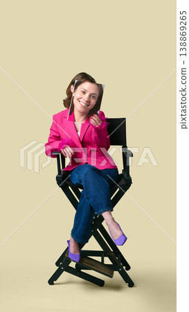 Woman sitting with printed smiling face for social media engagement and content Woman sitting with printed smiling face for social media engagement and content 138869265