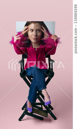 Woman in pink blazer holding printed face sheet for influencer branding content Woman in pink blazer holding printed face sheet for influencer branding content 138869266