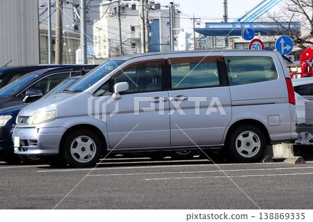 Passenger cars lined up in the parking lot 138869335