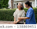 Asian caregivers provide compassionate assistance to seniors, ensuring quality elderly care. Their service supports health and well-being, reflecting the dedication in nursing homes for retirees. 138869451