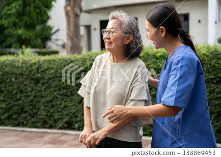 Asian caregivers provide compassionate assistance to seniors, ensuring quality elderly care. Their service supports health and well-being, reflecting the dedication in nursing homes for retirees. Asian caregivers provide compassionate assistance to seniors, ensuring quality elderly care. Their service supports health and well-being, reflecting the dedication in nursing homes for retirees. 138869451