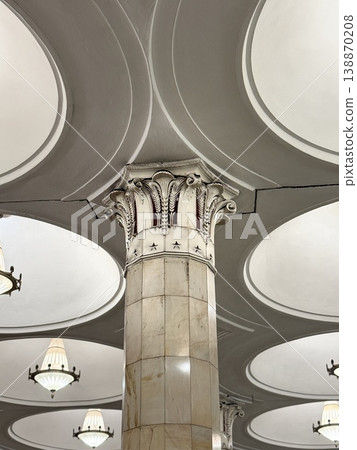 Ornate architectural column with intricate capital in classic interior design Ornate architectural column with intricate capital in classic interior design 138870208