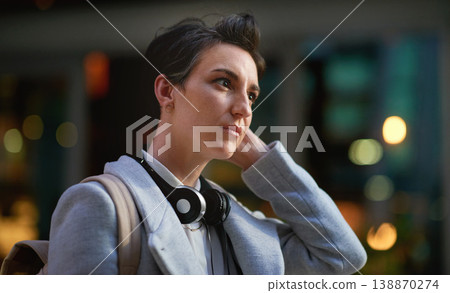 Business woman outdoor thinking, face and travel to work with headphones, mockup with bokeh and commute in city. Young creative, mindset and vision with web designer, career and growth in London Business woman outdoor thinking, face and travel to work with headphones, mockup with bokeh and commute in city. Young creative, mindset and vision with web designer, career and growth in London 138870274