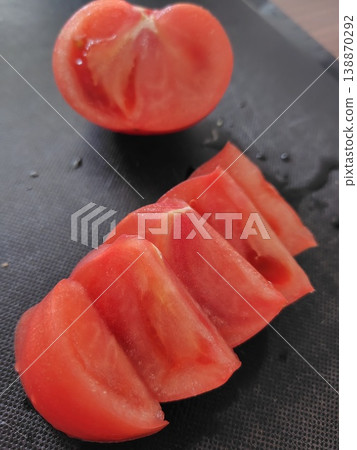 Sliced tomatoes and tomatoes cut in half 138870292