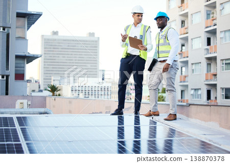 Solar panels, rooftop and engineering people in energy saving, urban sustainability and city installation teamwork. Inspection, checklist and technician men planning sustainable power solution Solar panels, rooftop and engineering people in energy saving, urban sustainability and city installation teamwork. Inspection, checklist and technician men planning sustainable power solution 138870378