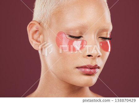 Eye patches, beauty and skincare of black woman with cosmetics and dermatology treatment. Relax, spa and young model in a studio with wellness facial for eyes and cosmetic face mask with collagen Eye patches, beauty and skincare of black woman with cosmetics and dermatology treatment. Relax, spa and young model in a studio with wellness facial for eyes and cosmetic face mask with collagen 138870429