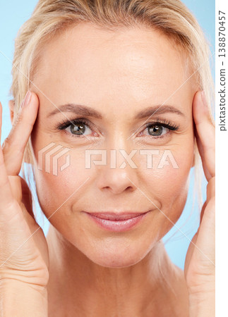 Portrait, senior woman and skincare with dermatology, cosmetics and against blue studio background. Face detox, mature female and lady with organic facial, salon treatment and grooming on backdrop Portrait, senior woman and skincare with dermatology, cosmetics and against blue studio background. Face detox, mature female and lady with organic facial, salon treatment and grooming on backdrop 138870457