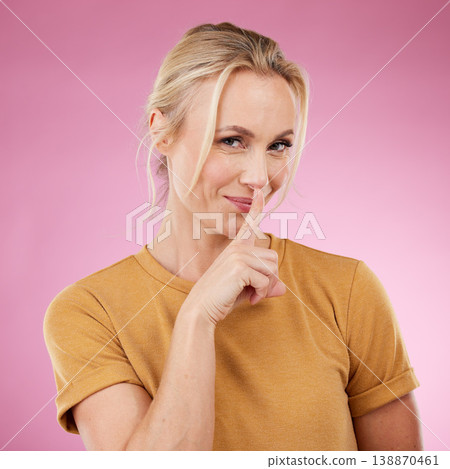 Secret, portrait and woman with lips on finger in studio, pink background and privacy. Female model with silence gesture on mouth for quiet, shush hands and gossip for whisper, silent emoji and smile 138870461