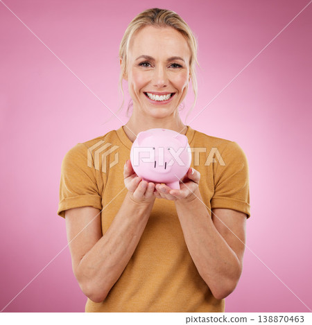 Woman, piggybank and portrait smile for savings, investment or cash money against a pink studio background. Happy female holding financial loan, profit or finance increase and salary on mockup Woman, piggybank and portrait smile for savings, investment or cash money against a pink studio background. Happy female holding financial loan, profit or finance increase and salary on mockup 138870463