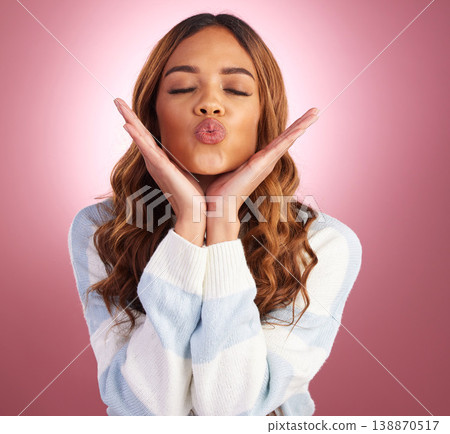 Kiss, face and woman in studio with love, silly and emoji expression with a purple background. Female model, youth and happiness of a young and happy person kissing with a pout and casual fashion 138870517
