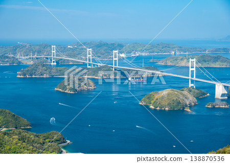 The Kurushima Kaikyo Bridge and the beautiful archipelago of the Seto Inland Sea as seen from Kirosan Observatory on the Shimanami Kaido. 138870536