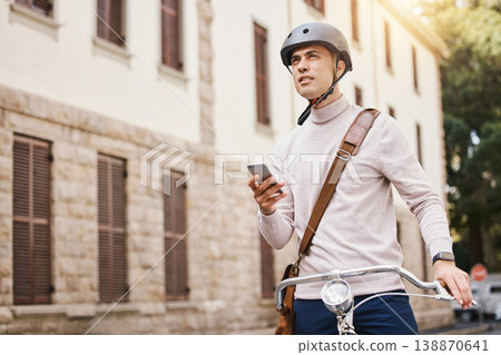Student man, bike and city with phone, thinking and search for building in street for college in summer. Young guy, retro bicycle and smartphone with transport on campus, road and outdoor with vision 138870641