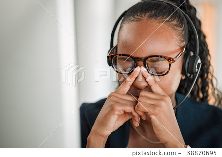 Call center stress, eye strain or black woman with headache pain due to burnout fatigue in a telecom office. Anxiety, glasses or tired consultant depressed or frustrated by long hours or migraine Call center stress, eye strain or black woman with headache pain due to burnout fatigue in a telecom office. Anxiety, glasses or tired consultant depressed or frustrated by long hours or migraine 138870695