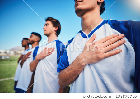 Football team, national anthem and listening at stadium before competition, game or match. Soccer, song and sports players together for pride, collaboration for contest or exercise with hands closeup 138870710