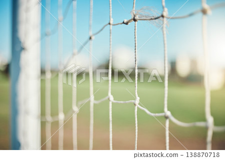 Empty, sports and goal post on soccer field for fitness training, exercise or workout outdoors. Football club, grass pitch background or closeup of blur net of game in competition or match contest 138870718
