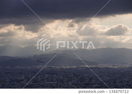 An airplane flying over a residential area An airplane flying over a residential area 138870722