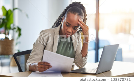 Laptop, document and businesswoman with stress in the office while working on a project deadline. Overworked, computer and African female lawyer with burnout reading legal paperwork in the workplace. 138870781