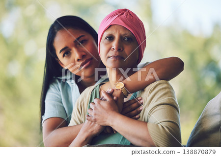 Portrait of mother with cancer, adult daughter in garden and support, love and care in family relationship. Kindness, woman with mom in chemotherapy rehab and hug for courage, hope and healthcare. Portrait of mother with cancer, adult daughter in garden and support, love and care in family relationship. Kindness, woman with mom in chemotherapy rehab and hug for courage, hope and healthcare. 138870879
