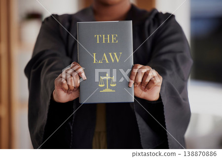 Hands, lawyer or advocate with book, constitution research or education for learning the justice system. Woman, judge or closeup of attorney studying knowledge, guide or information for legal agency 138870886