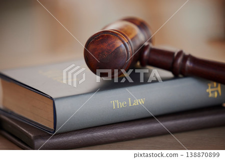 Background, gavel and law books on table of attorney, judge and justice for courtroom. Closeup of legal hammer, notebook and desk of lawyer in constitution of truth, fair information and human rights 138870899