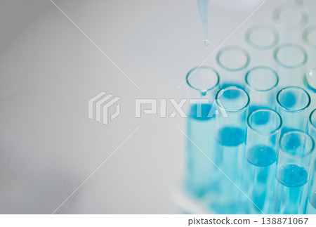 Blue chemical in test tube, science and closeup with mockup space, medical research and chemistry in lab. Scientific study, experiment and biotechnology with liquid solution in glass container Blue chemical in test tube, science and closeup with mockup space, medical research and chemistry in lab. Scientific study, experiment and biotechnology with liquid solution in glass container 138871067
