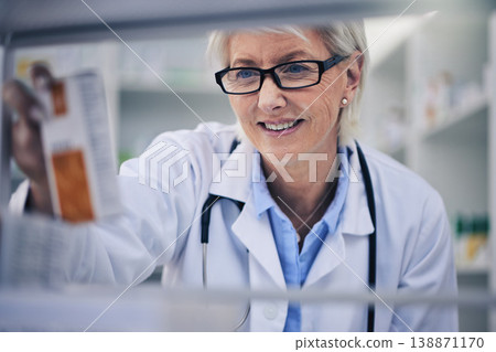 Senior woman, pharmacist and reading medication on shelf for inventory, diagnosis or prescription at pharmacy. Happy mature female person, medical or healthcare professional checking medicine in shop Senior woman, pharmacist and reading medication on shelf for inventory, diagnosis or prescription at pharmacy. Happy mature female person, medical or healthcare professional checking medicine in shop 138871170