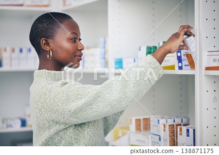 Black woman, customer and box on shelf for pills, medicine or medication at the pharmacy. African female person or patient shopping pharmaceutical product or drugs for healthcare cure at clinic store Black woman, customer and box on shelf for pills, medicine or medication at the pharmacy. African female person or patient shopping pharmaceutical product or drugs for healthcare cure at clinic store 138871175