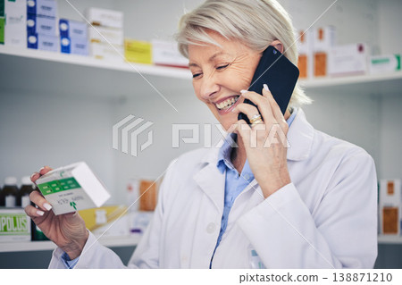 Happy woman, pharmacist and phone call with medication for telehealth, communication or advice at pharmacy. Female person, medical or healthcare expert talking on smartphone for online consultation 138871210