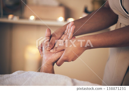 Woman, hands and massage in relax for spa treatment, body care or physical therapy at the resort. Closeup of female person holding hand for stress relief, comfort or zen in healing or reiki at salon Woman, hands and massage in relax for spa treatment, body care or physical therapy at the resort. Closeup of female person holding hand for stress relief, comfort or zen in healing or reiki at salon 138871231