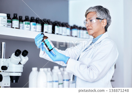 Lab, science and woman checking bottle from shelf for medical research information and solution. Healthcare, medicine and innovation in manufacturing vaccine or chemical drugs with senior scientist. Lab, science and woman checking bottle from shelf for medical research information and solution. Healthcare, medicine and innovation in manufacturing vaccine or chemical drugs with senior scientist. 138871248