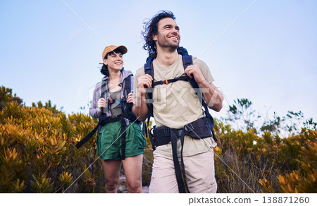 Hiking, travel and couple walking in nature for adventure, holiday and sightseeing journey on mountain. Fitness, dating and happy man and woman excited to explore, trekking and backpacking outdoors Hiking, travel and couple walking in nature for adventure, holiday and sightseeing journey on mountain. Fitness, dating and happy man and woman excited to explore, trekking and backpacking outdoors 138871260