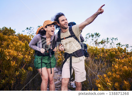 Hiking, pointing and excited couple in nature for adventure, holiday and journey on mountain. Travel, dating and man and woman walking with surprise and wow for view, trekking and backpacking outdoor Hiking, pointing and excited couple in nature for adventure, holiday and journey on mountain. Travel, dating and man and woman walking with surprise and wow for view, trekking and backpacking outdoor 138871268