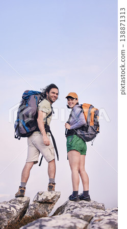 Mountain, hiking and portrait of man with woman on peak for adventure in nature, rock climbing and travel. Outdoor trekking, happy couple on cliff and relax in mockup space for journey with backpack. Mountain, hiking and portrait of man with woman on peak for adventure in nature, rock climbing and travel. Outdoor trekking, happy couple on cliff and relax in mockup space for journey with backpack. 138871313