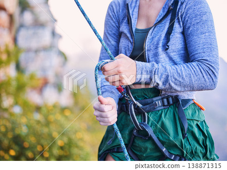 Rock climbing, mountain and hands of woman with rope harness for adventure, freedom and extreme sports. Fitness, nature and female person with equipment or gear for training, activity and challenge Rock climbing, mountain and hands of woman with rope harness for adventure, freedom and extreme sports. Fitness, nature and female person with equipment or gear for training, activity and challenge 138871315