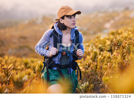 Mountains, hiking and woman in backpack for nature journey, travel and outdoor adventure with bush or plants. Young person from Australia search field, trekking and walking with fitness gear 138871324